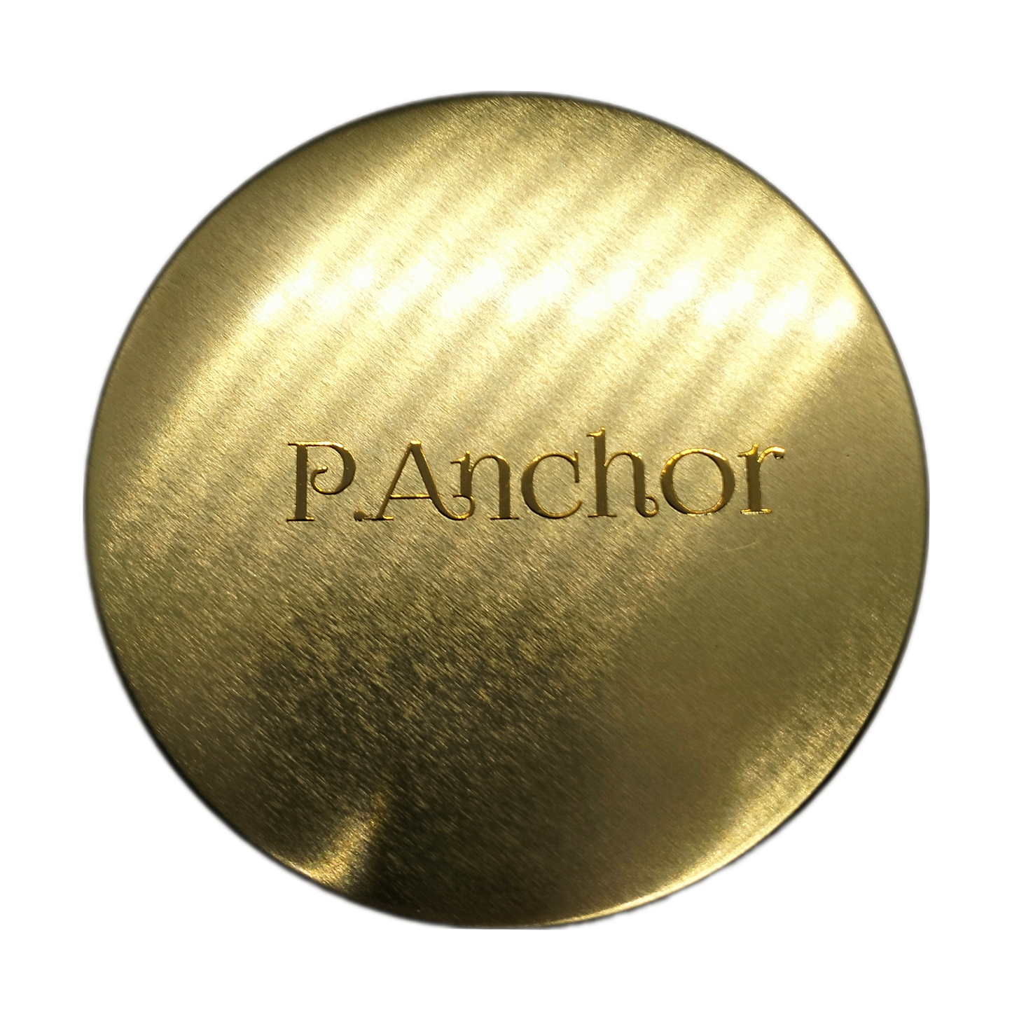 Close-up of gold metallic candle lid with embossed P.Anchor logo