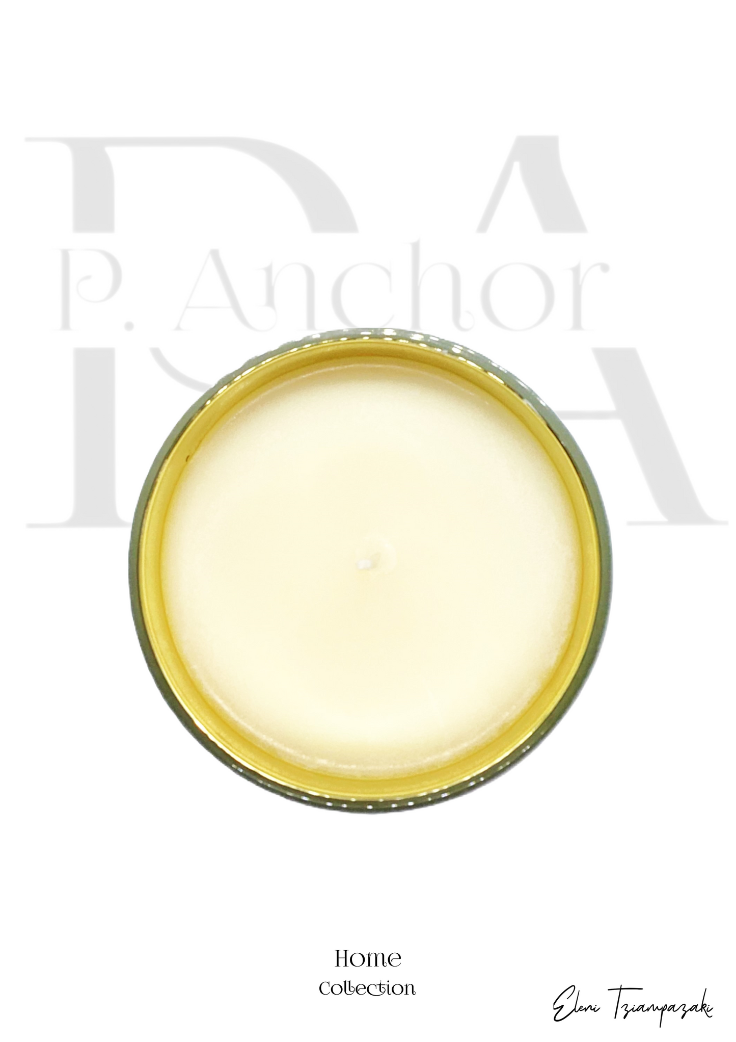 Top view of unlit vanilla-scented candle in a round gold-rimmed glass jar