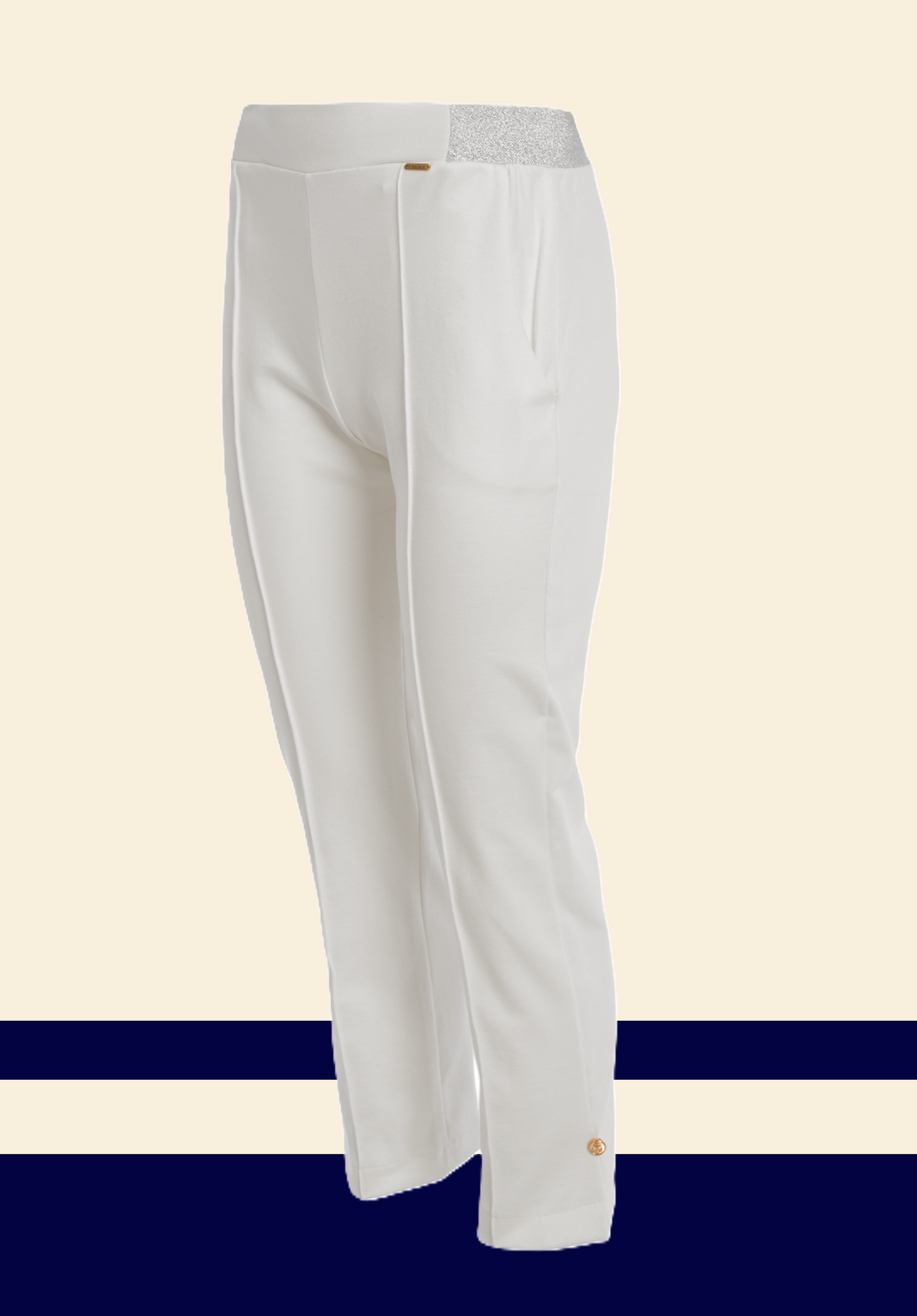 "White unisex trousers with a silver glitter waistband and a gold button detail at the ankle, featuring a clean front seam and side pockets."