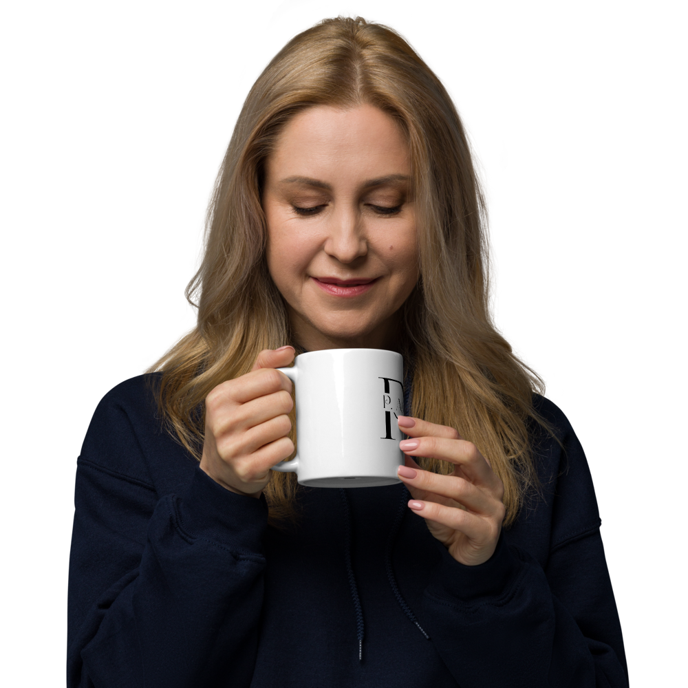 Woman holding a white mug with a logo on a white background