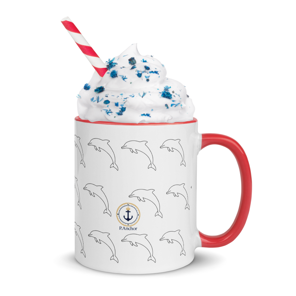 Mug with dolphin pattern, red handle, and whipped cream on a white background