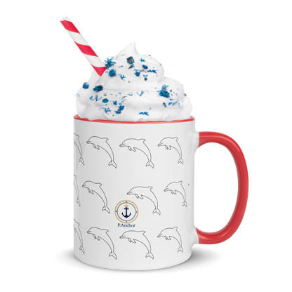 Mug with dolphin pattern, red handle, and whipped cream on a white background