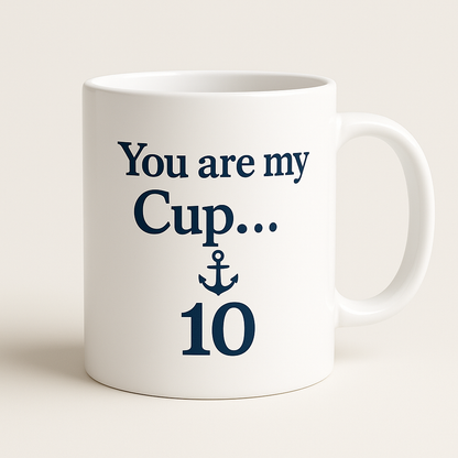 White mug with blue text and anchor design on a white background