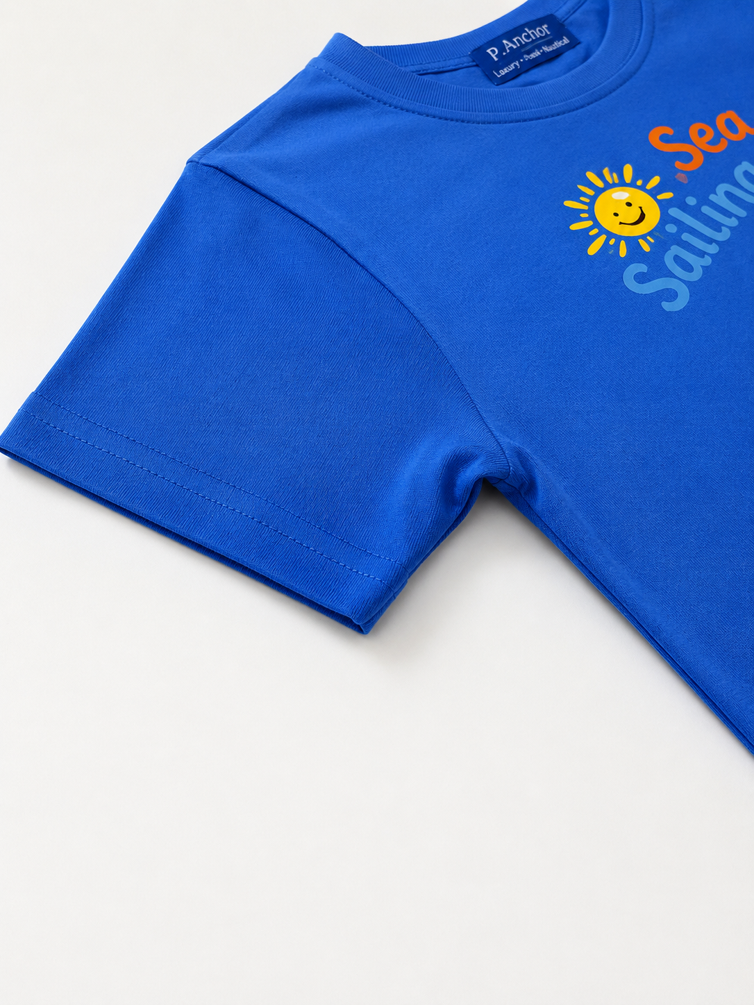 Blue t-shirt with a sun and text design on a white background