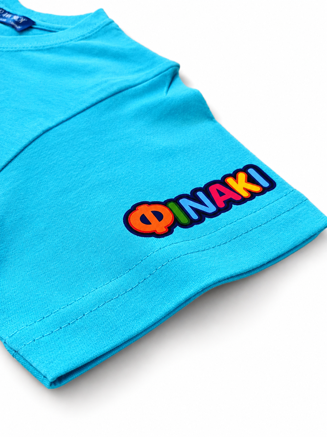 Close-up of a blue sleeve with a colorful logo on a white background