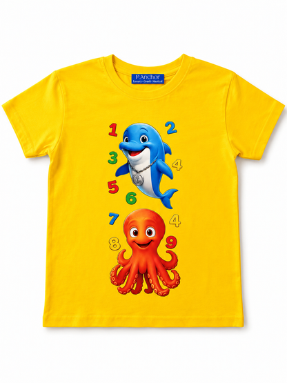 Yellow t-shirt with a blue dolphin and red octopus design on a white background