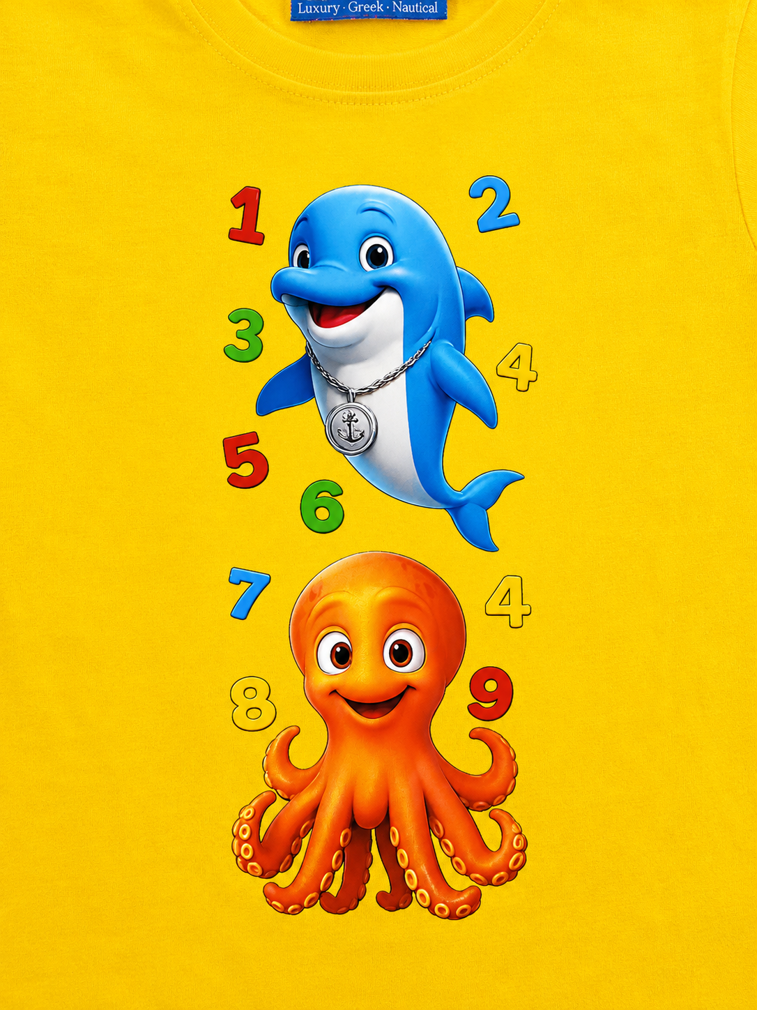 Yellow t-shirt with a blue dolphin and orange octopus design on a yellow background