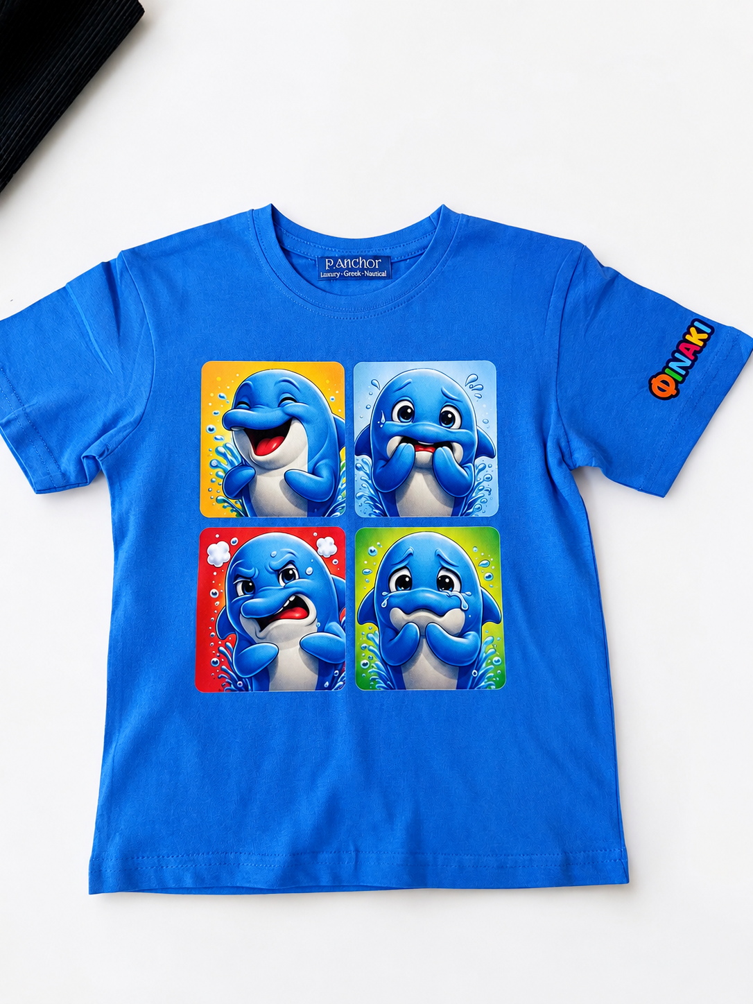 Blue t-shirt with cartoon dolphins on a white background