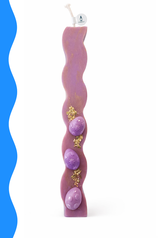Wavy purple candle with decorative elements on a white background
