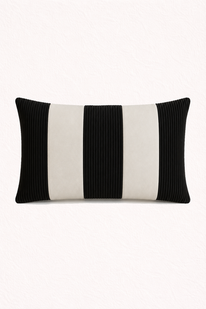Black and white striped pillow on a white background