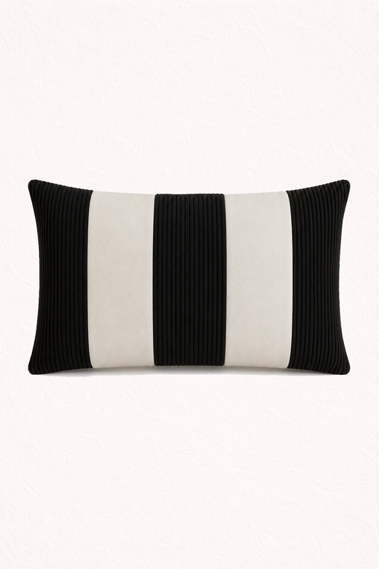 Black and white striped pillow on a white background
