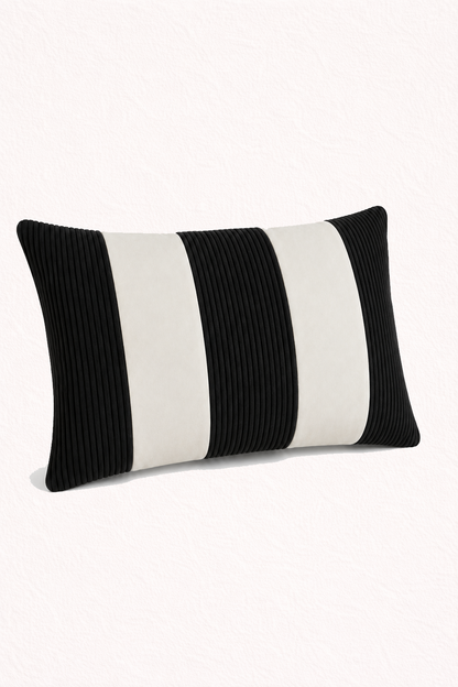 Black and white striped pillow on a white background