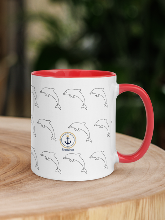 White ceramic mug with red interior and handle, dolphin pattern and P.ANCHOR nautical logo