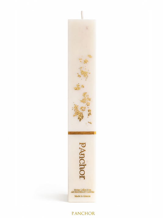 White candle with gold floral design and 'Panchor' branding on a white background