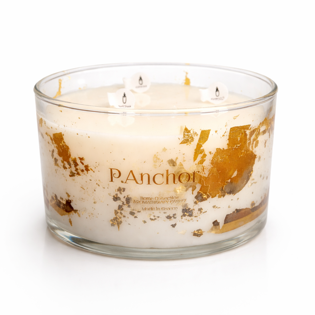 Three-wick candle with gold leaf design and 'P. Anchor' branding on a white background