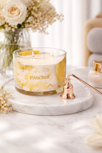 Porch & Company candle on a marble tray with flowers and decor in the background