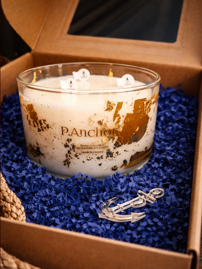 Candle with anchor design in a box with blue lining