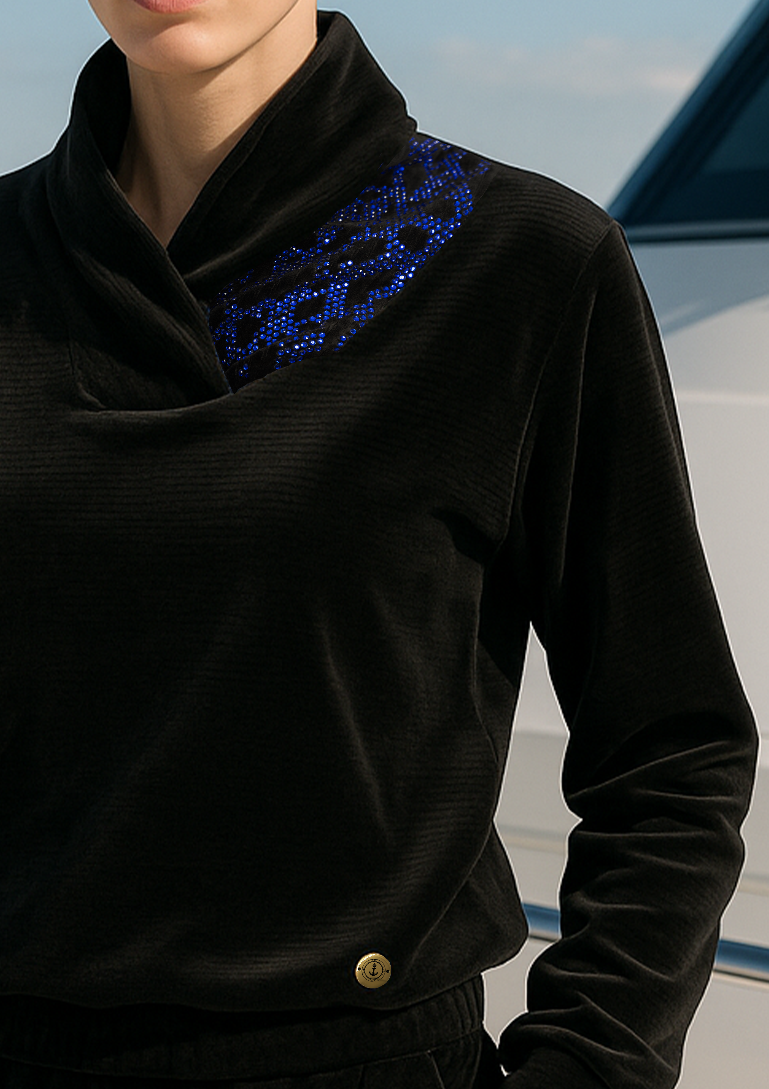 "Luxury women's black velvet tracksuit with blue detail and draped collar – nautical style loungewear by P. ANCHOR, photographed on yacht"