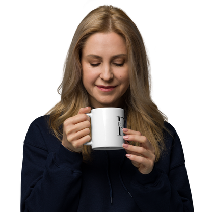 Woman holding a white mug with a logo on a white background