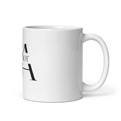 White ceramic mug P.ANCHOR with calligraphic logo and subtle nautical anchor and crown design.