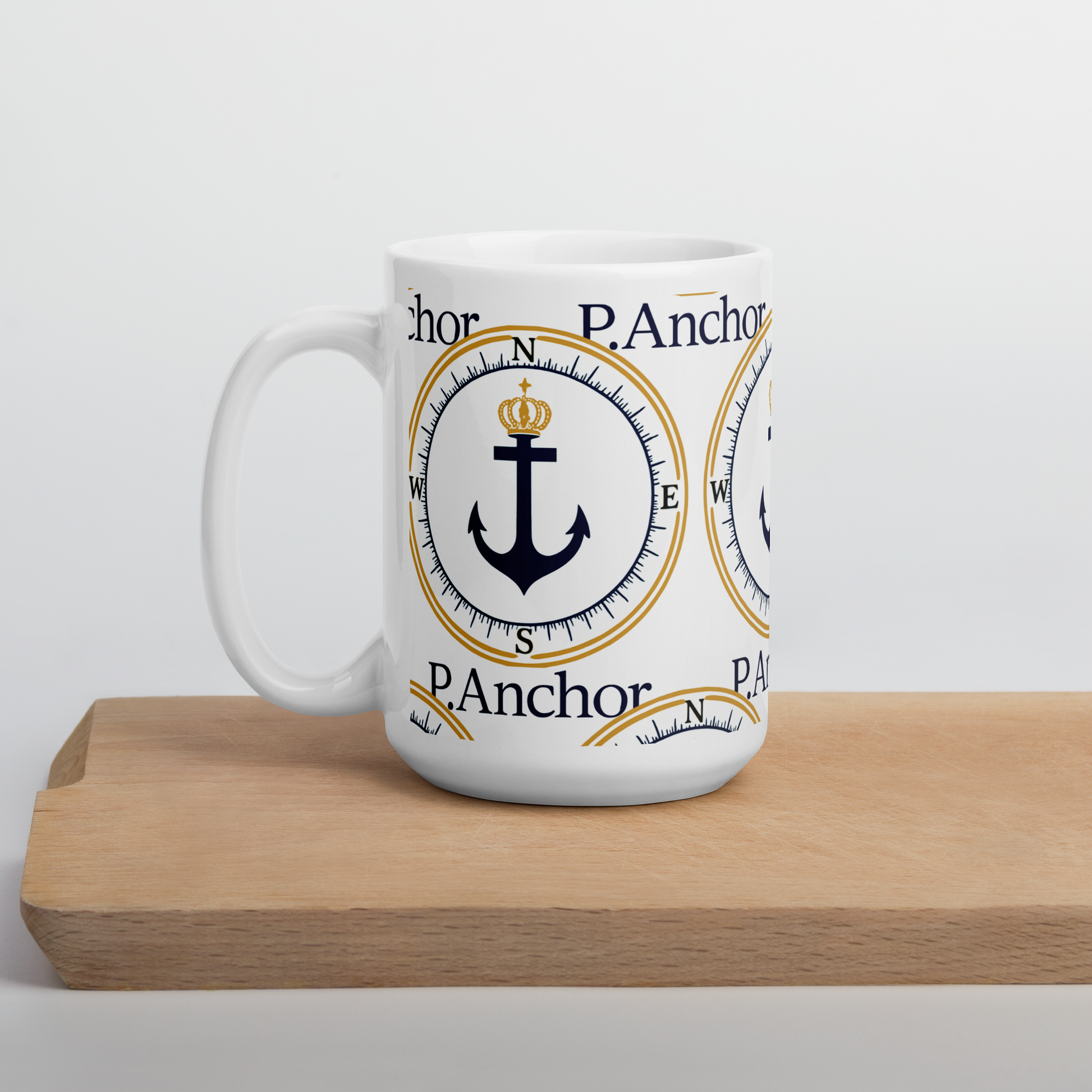 P.ANCHOR ceramic mug with nautical anchor and crown design in navy blue and gold.